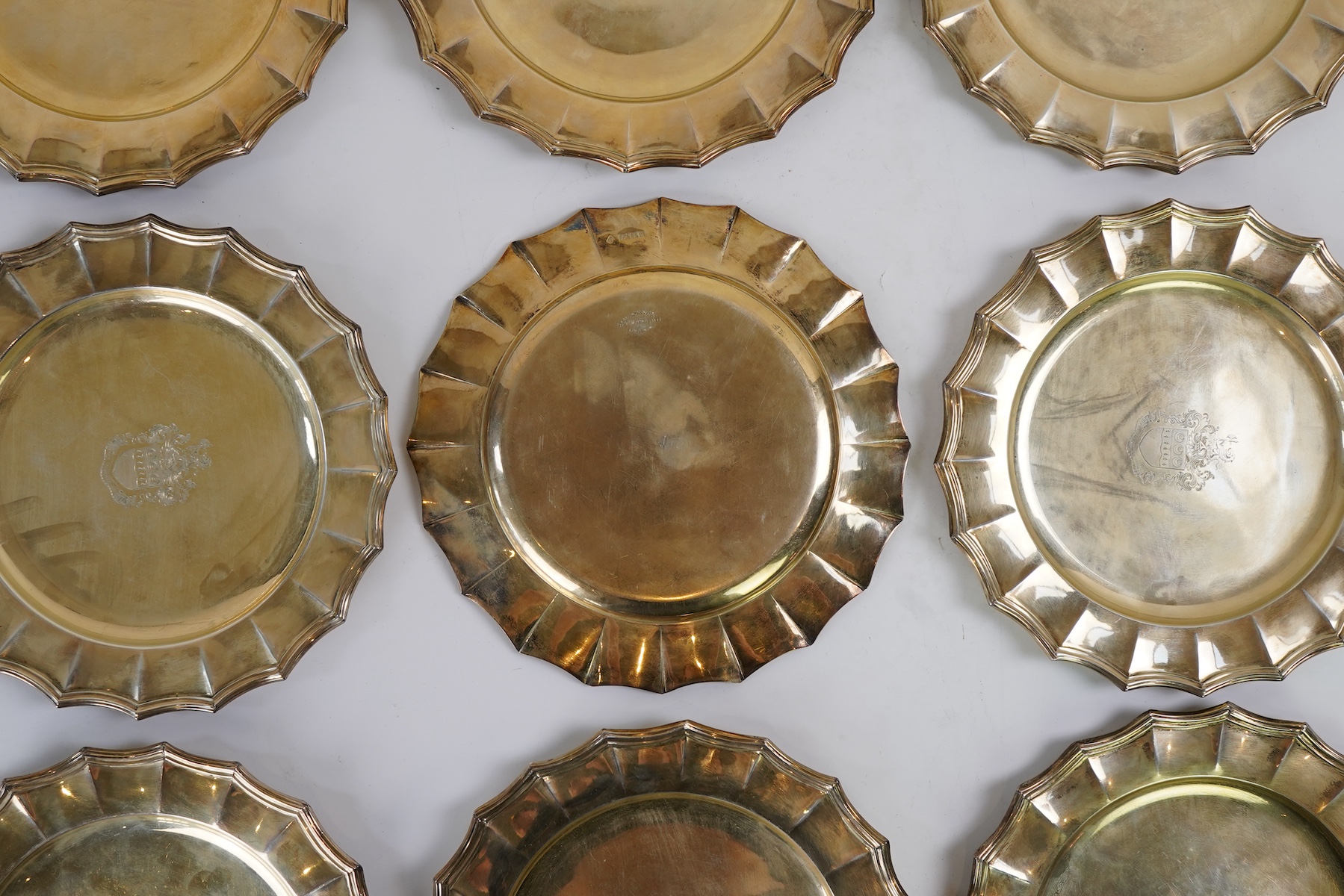 A set of twelve George V silver gilt side plates by J.S. Harman & Co